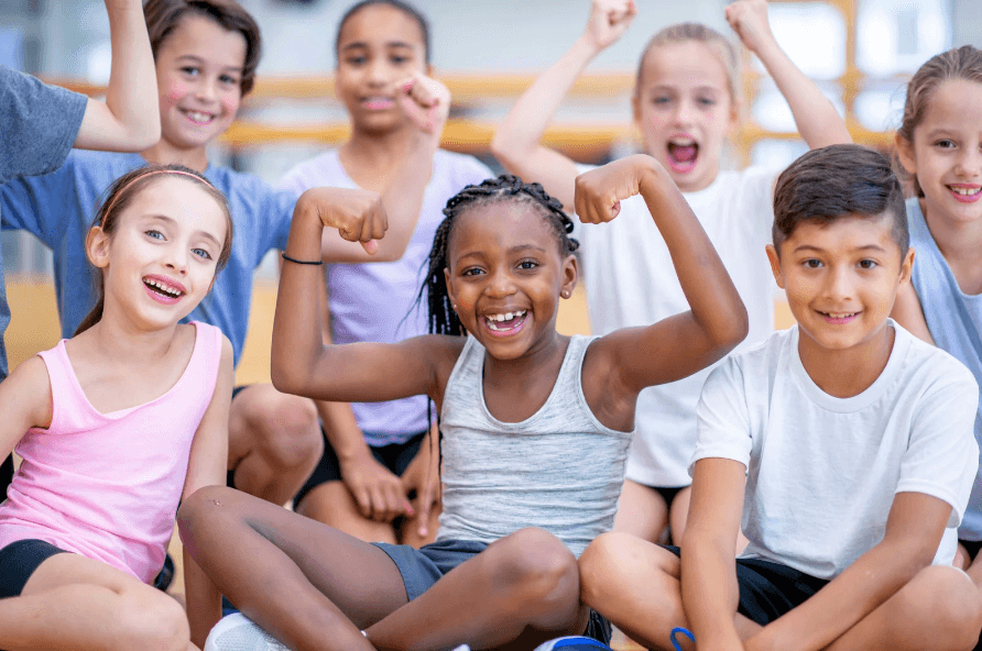 Group of kids flexing and showing off their strength