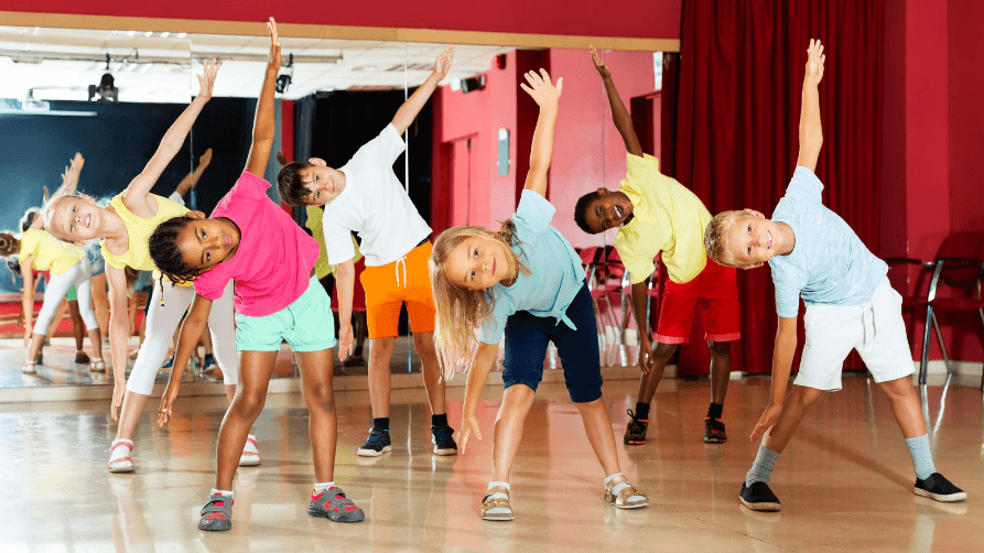 Kids stretching together during PE class